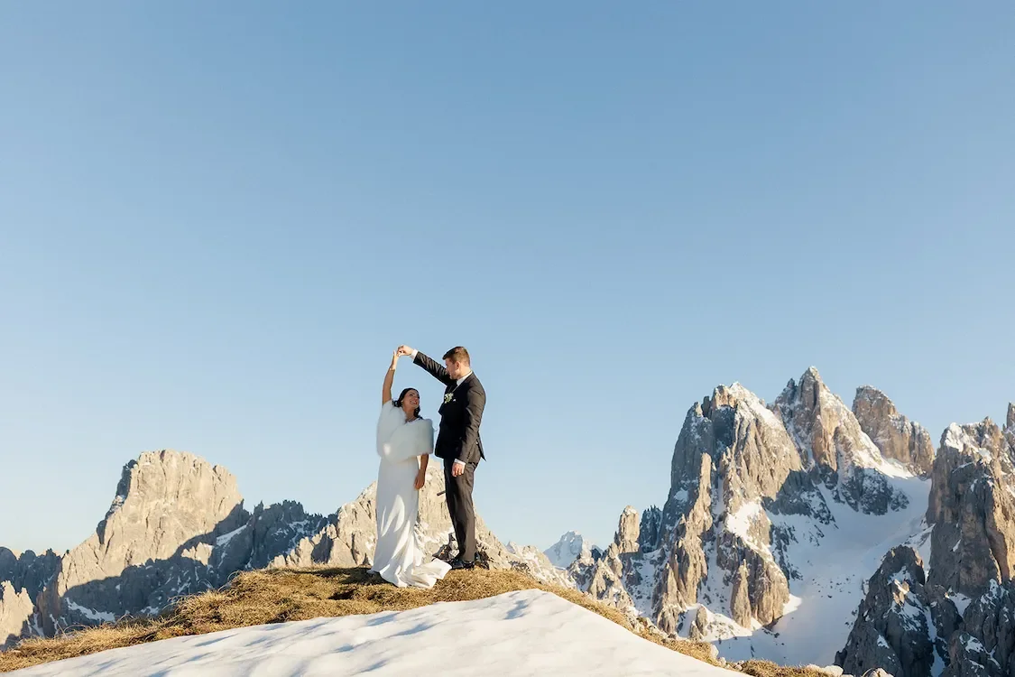 Elopement couple portrait on mountain in Dolomites, Italy