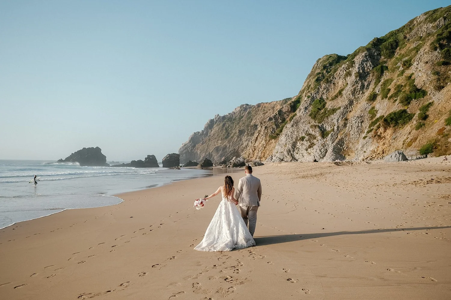 Elopement wedding portrait of bride and groom beach in portugal