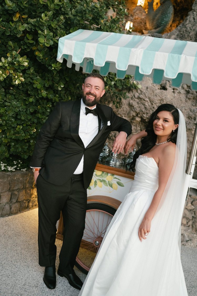 A couple by the striped kiosk at the foot of the cliffs